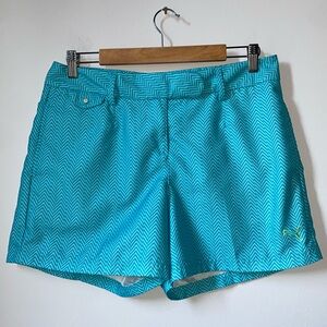 Puma women’s golf polyester shorts, teal color, pockets, size 8